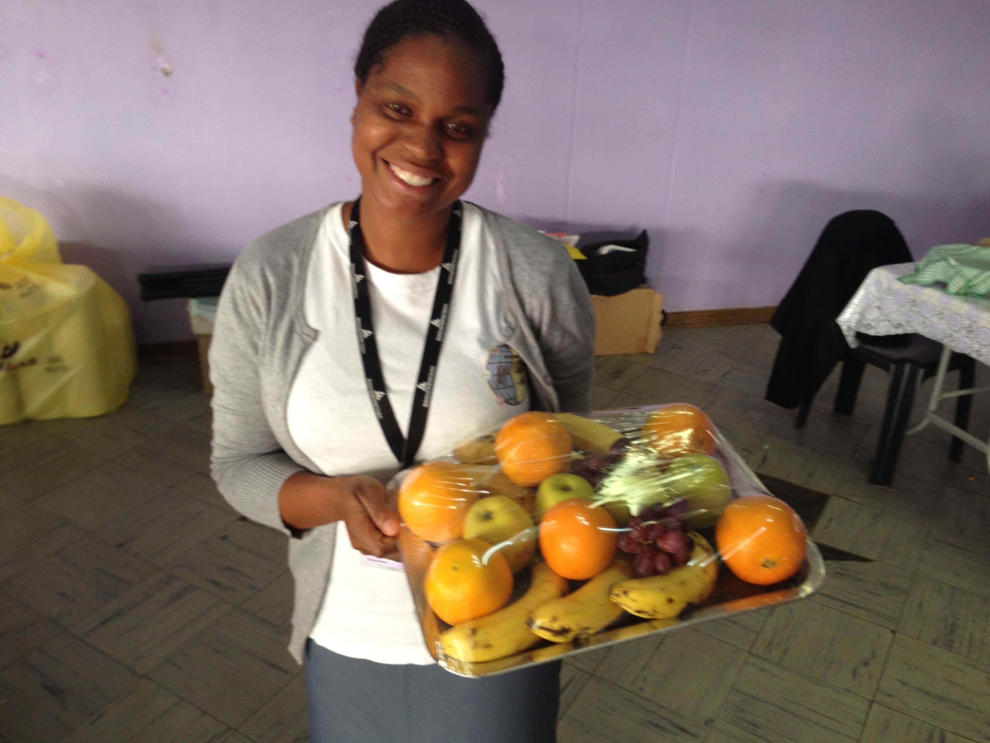 A volunteer preparing a meal for the patients in the diabetes program. (Andrew McChesney / AR)