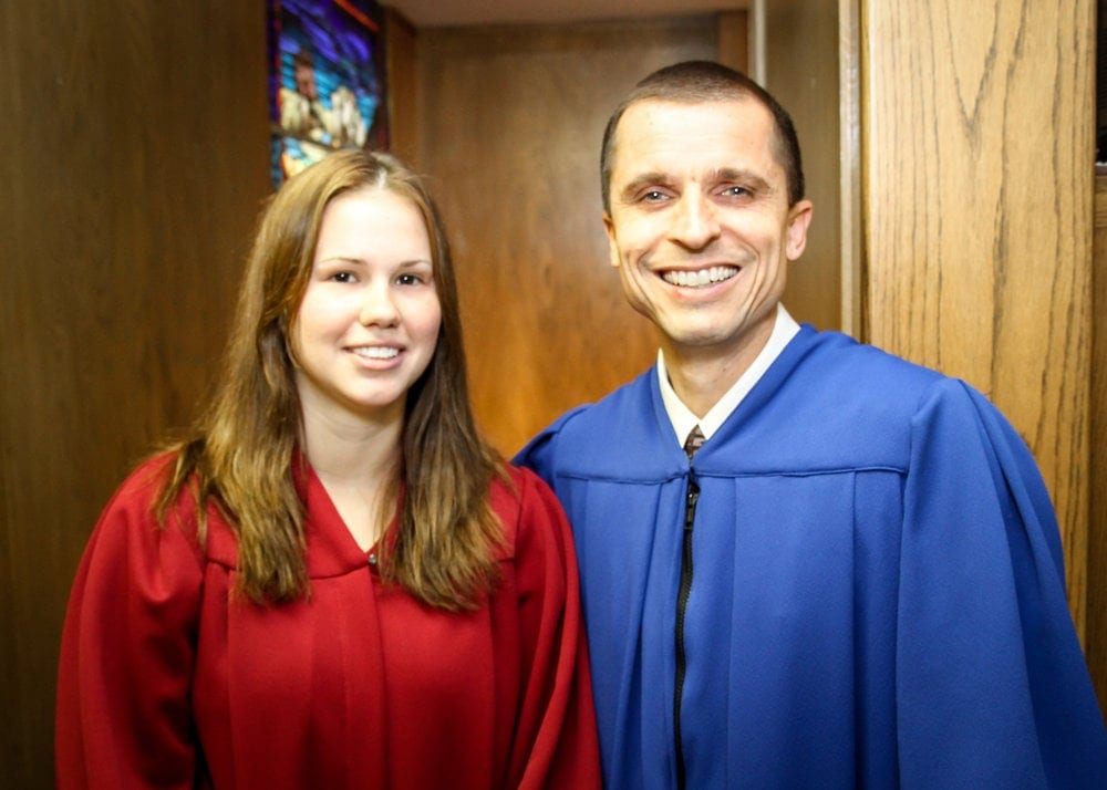Tabatha Azua posing with Ingo Sorke, religion professor at Southwestern Adventist University. Photo: Jorge Velez
